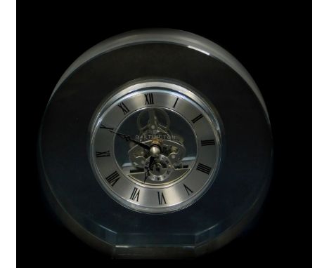 A Dartington crystal mantel clock, of circular form, silvered chapter ring bearing Roman numerals, subsidiary seconds dial, v