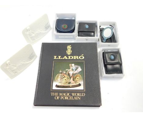 A Lladro porcelain blue hand mirror, coin purse, and two wallets, all boxed., together with Lladro; The Magic World of Porcel