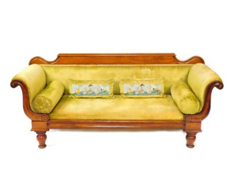 A late Regency mahogany scroll end sofa, upholstered in green draylon raised on baluster turned legs, 207cm wide.