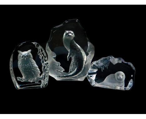 A Mats Jonasson intaglio glass sculpture carved as an otter, etched mark, 16cm high, another intaglio carved as a seal pup, 1