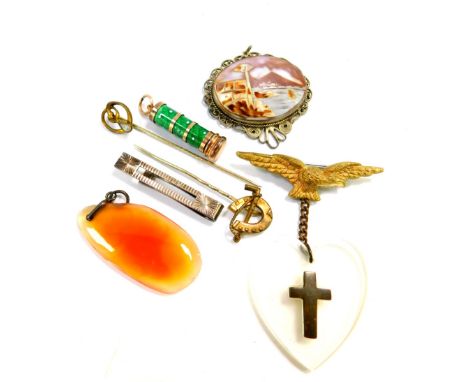 An Italian shell cameo pendant, View of the Bay of Naples with Vesuvius beyond, in a white metal filigree surround, an Air Fo