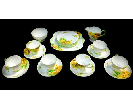 A Shelley porcelain part tea service, decorated in the John Quil daffodil pattern, comprising bread plate, cream jug, sugar b