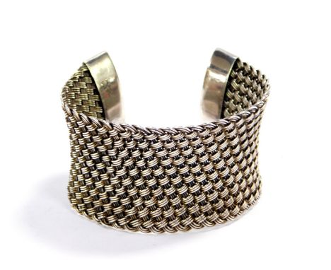 A Suarti silver cuff bangle, of wide basket weave design, 59g.