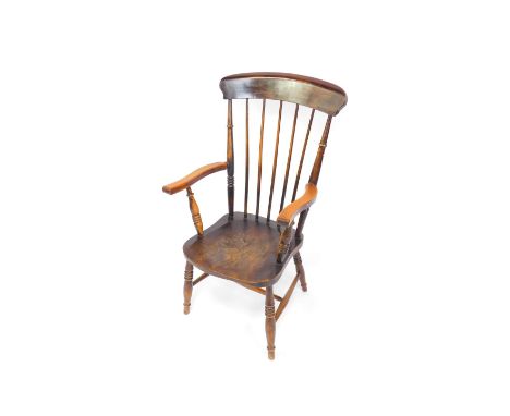 A Victorian oak and elm lady's stick back kitchen chair, raised on turned legs united by an H frame stretcher.