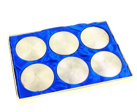 A set of six silver coasters, with engine turned decoration, boxed, Birmingham 1979.