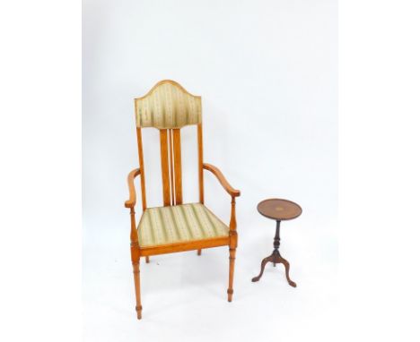 A Victorian mahogany and ivory line inlaid carver chair, with upholstered head rest and seat, raised on turned legs, together