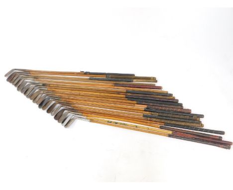 Twenty vintage golf clubs, all irons with wooden shafts, to include makers Archie Tait of Port Patrick., C R Buckle., E L Che