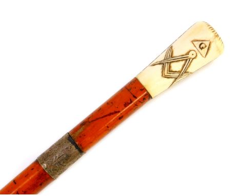 A Victorian Masonic malacca sword stick, with ivory handle, carved with the all seeing eye, dove, set square and compass, wit