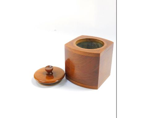 An Art Deco walnut bow fronted square tea caddy, with a cylindrical lid, 12.5cm high.