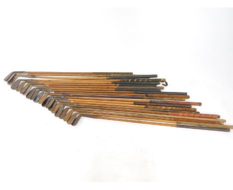 Vintage golf clubs, all irons with wooden shafts. (20)