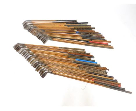 A collection of vintage golf clubs, all irons and wedges with wooden shafts. (41)