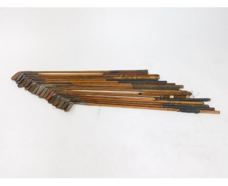 Vintage golf clubs, all irons with wooden shafts. (17)