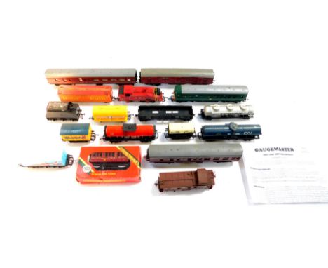 A OO gauge diesel locomotive M79079, three Tri-ang coaches, wagons and a Lima LMS tank engine 8920. (quantity)