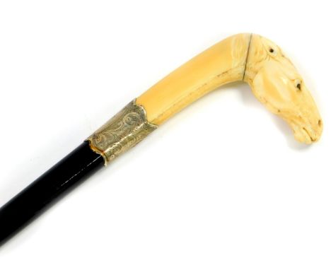 An ebony walking stick, with marine ivory handle, carved as a horse's head, silver ferrule, foliate engraved, hallmarks indis