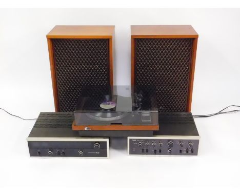 A Sansui record player, SR-4050C, stereo amplifier, AO-7500, and an AM/FM stereo tuner, TU-9500, together with a pair of four