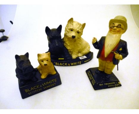 2 BLACK AND WHITE SCOTCH WHISKY DOG FIGURES AND A WM YOUNGER'S TARTAN KEG FIGURE