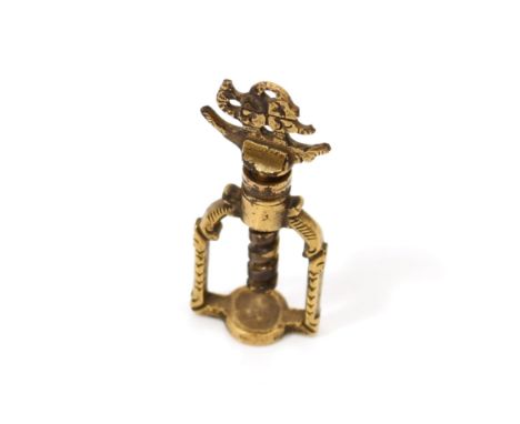 Nutcrackers - a 17th/early 18th century brass screw-action pocket nut cracker, stirrup-shaped frame, 6.5cm long, c.1660-1720 