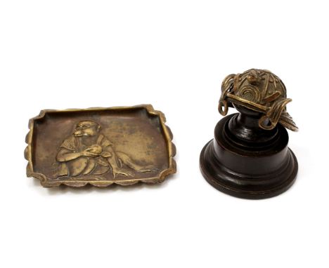 A Japanese brass ring tray, amusingly embossed with a monkey wearing spectacles, 8cm wide, early 20th century; a miniature Sa