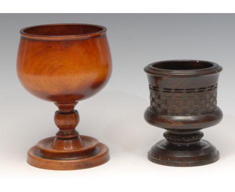 Treen - a turned goblet, 15cm high; another, lignum vitae, engine-turned central band, 11cm high (2) 