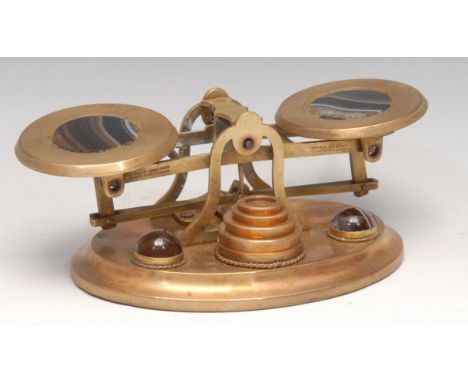 A set of Victorian gilt brass and banded agate letter balance postal scales, 17.5cm wide, c.1870 
