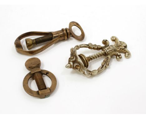 Nutcrackers - a 19th century silvered brass screw-action travelling pocket nut cracker, the lyre-shaped bow with fruiting oak