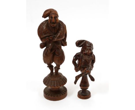 Nutcrackers - a 19th century French novelty screw-action table top figural nut cracker, carved as a caricatured man wearing p