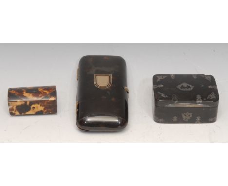 An early 19th century tortoiseshell and silver pique rounded rectangular table snuff box, 8.5cm wide, c.1810; a tortoiseshell