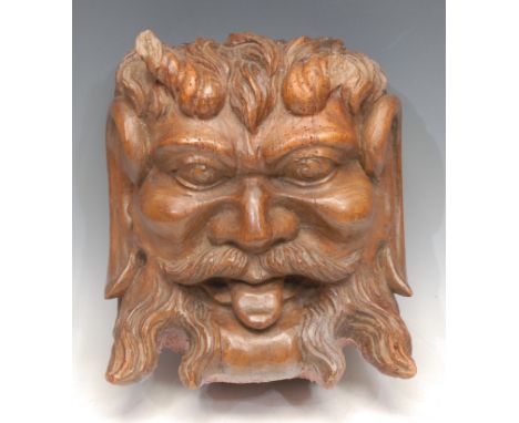 A large 19th century oak architectural boss, carved as a 'Green Man' foliate mask, 29cm long 