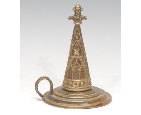 An early Victorian Gothic Revival brass candle snuffer and stand, embossed with tracery and architectural devices, stepped ba