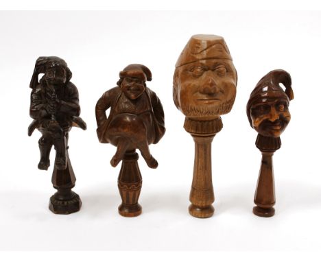 Nutcrackers - a Black Forest screw-action novelty nut cracker, carved as a gentleman playing a horn, 16.5cm long; others (4) 