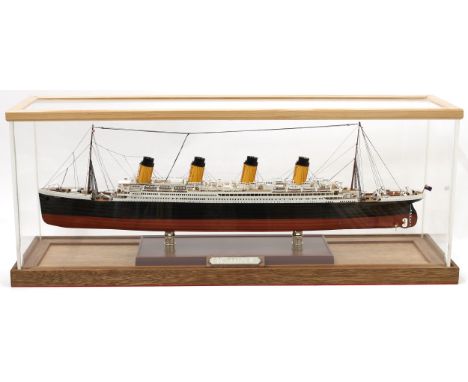 A maritime model ship, RMS Titanic, 1/350th scale, hand painted, cased, 83cm wide overall 