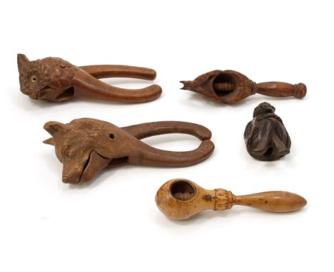 Nutcrackers - a Black Forest lever-action novelty nut cracker, carved as the head of an Alsatian dog, 20.5cm long, c.1900 (fa