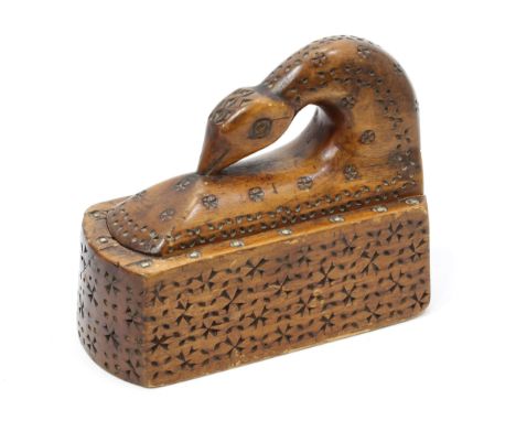 Treen - a 19th century Scandinavian chip-carved table snuff box, the hinged cover as a stylised bird's head, 15cm wide 