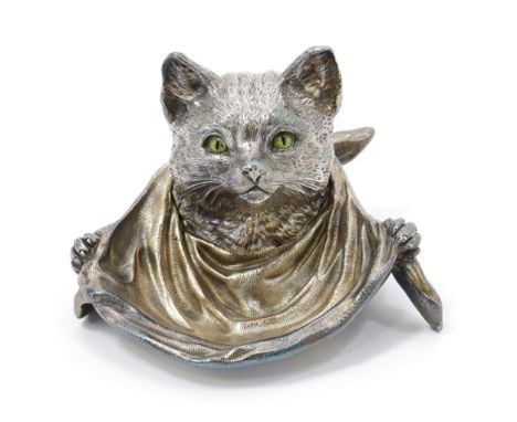 A silver plated novelty inkwell, as a cat wearing a bib, enamel eyes, hinged cover, 13.5cm wide 