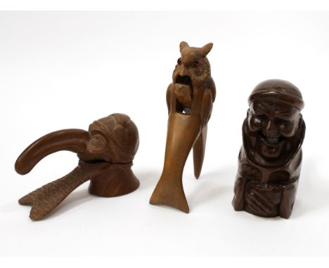 Nutcrackers - a Black Forest novelty lever-action table top nut cracker, carved as the head of a grotesque man with long nose