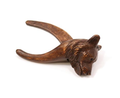 Nutcrackers - a Black Forest lever-action novelty nut cracker, carved as the head of a bear, 15cm long, early 20th century 