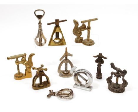 Nutcrackers - an early 20th century nickel plated travelling pocket corkscrew, marked Registered Design, 8.5cm long; others (