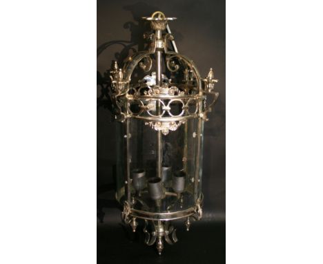 A Large Cylindrical Hall Lantern, with four curved glass panels and of pierced form, 69 cms high