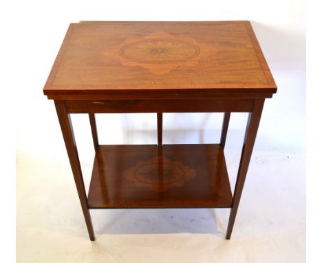 An Edwardian Mahogany Marquetry Inlaid Card Table, the hinged top enclosing a baize lined interior above an inlaid under tier