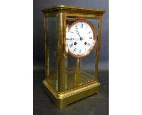 A 19th Century French Brass Cased Four Glass Library Clock, the enamel dial with Roman numerals and two train movement by Jap