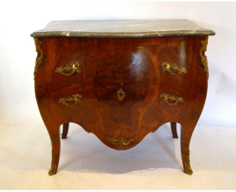 A Louis XVI Style Bombe Commode, the serpentine variegated marble top above two drawers with gilt metal mounts and handles ra