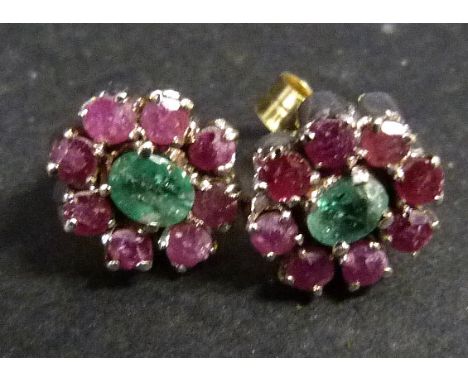 A White Metal Pendant Set With Cabochon Amethyst Surrounded By Diamonds, together with a pair of matching ear studs together 