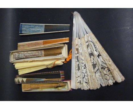 A Mother of Pearl and Lacework Fan, together with seven other fans and a porcelain pin doll complete with cushion, a long car