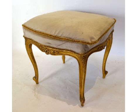 A Late 19th Early 20th Century French Gilded Stool of Square Form, with a carved shaped frieze raised upon cabriole legs with