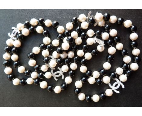A Cultured Pearl and Black Glass Long Bead Necklace, set with 925 silver mounts