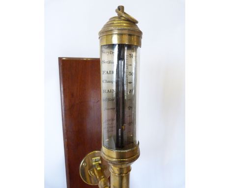 A Brass Marine Stick Barometer by R N Desterro, Lisbon mounted upon a rectangular mahogany wall plate, 93 cms long