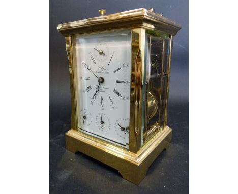 A 20th Century French Brass Cased Carriage Clock, the enamel dial with subsidiary seconds, day, date and month dials, the rep