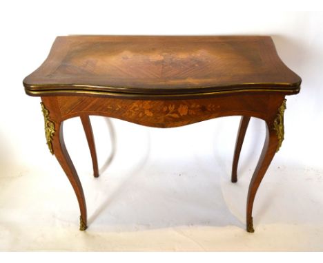 A 19th Century French Kingwood and Marquetry Inlaid Gilt Metal Mounted Serpentine Card Table, the hinged top enclosing a baiz