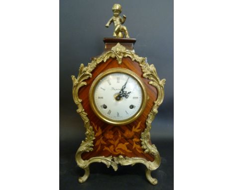 A 20th Century French Kingwood and Marquetry Inlaid Gilt Metal Mounted Mantle Clock, the enamel dial with Roman numerals and 