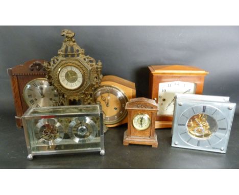 A 1920's Walnut Cased Mantle Clock by Smiths, together with six other clocks